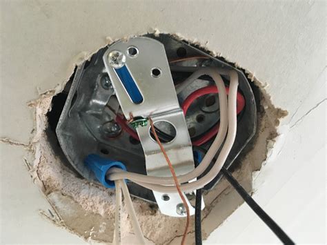 attaching electrical boxes to metal ceiling|installing ceiling light electrical box.